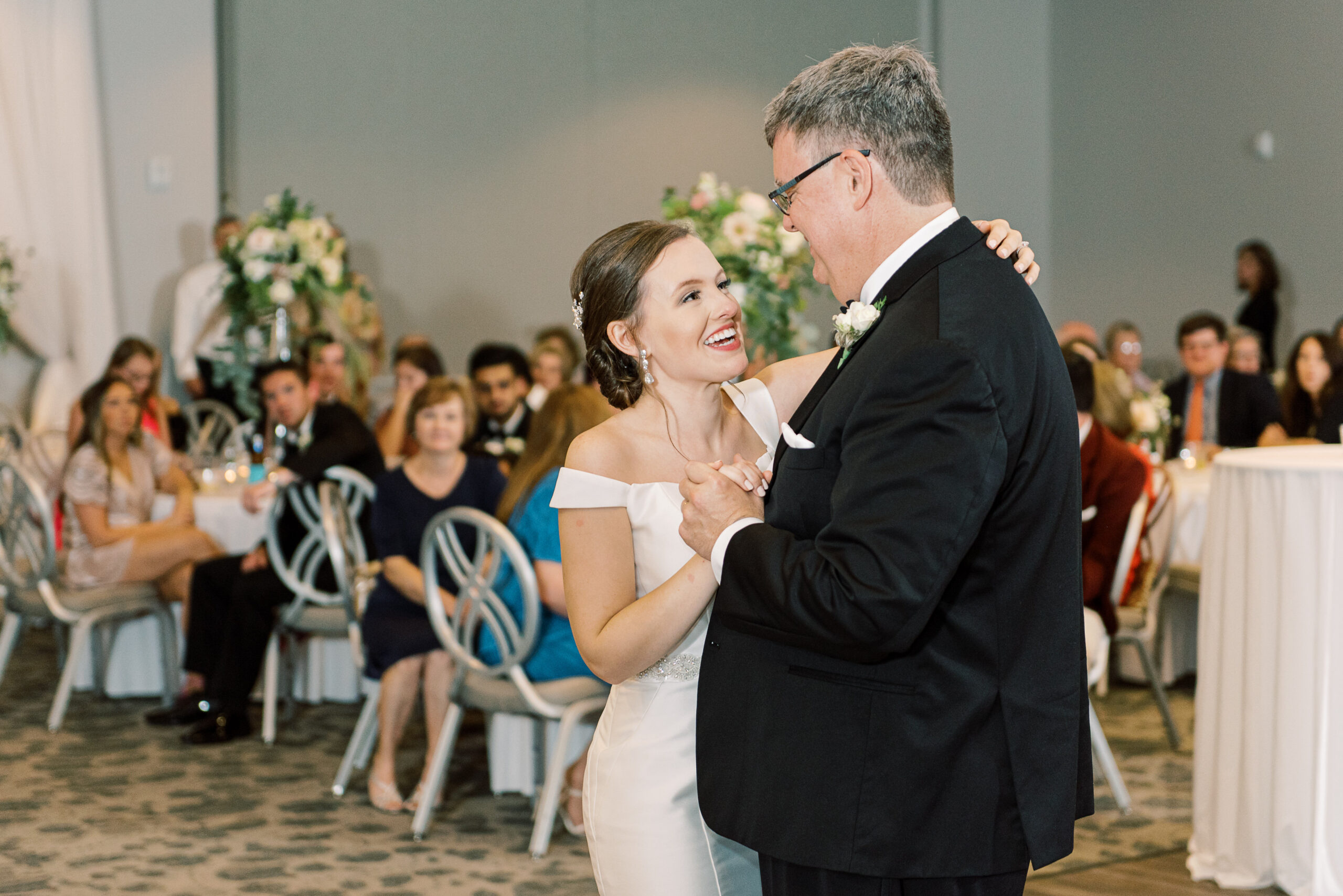 Father's Day gift guide. A father and daughter dance at her wedding reception.